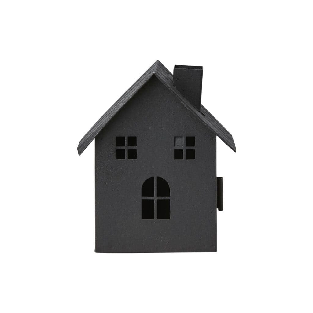 Svart ljuslykta i form av ett hus, sett framifrån.